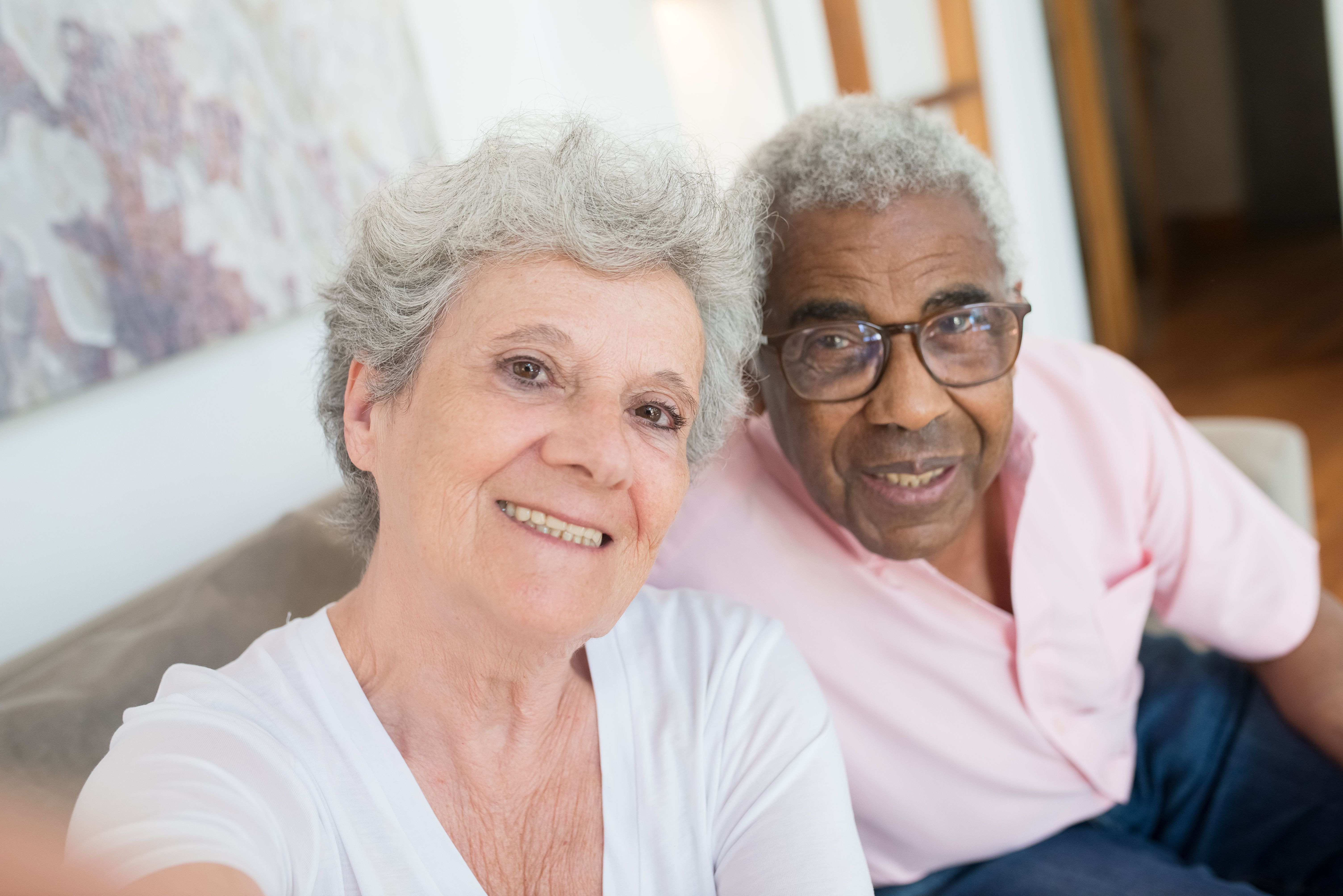 Two older adults happy and connected at home